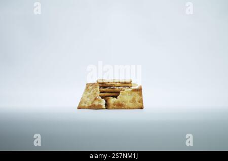 Stack of Salty Crackers Isolated on a Plain White Background Stock Photo