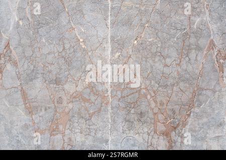 A closeup view of gray marble featuring natural brown veins in an organic pattern Stock Photo