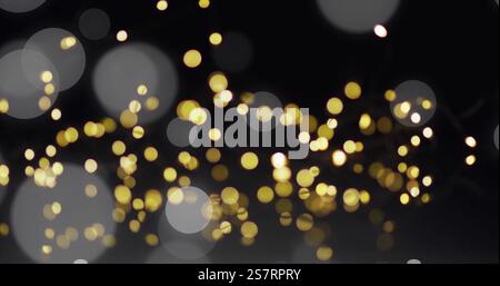 Golden bokeh lights image over dark background Stock Photo