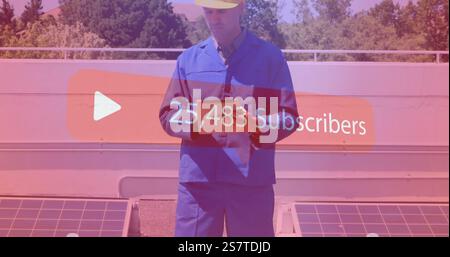 Construction worker holding tablet over subscriber count image Stock Photo
