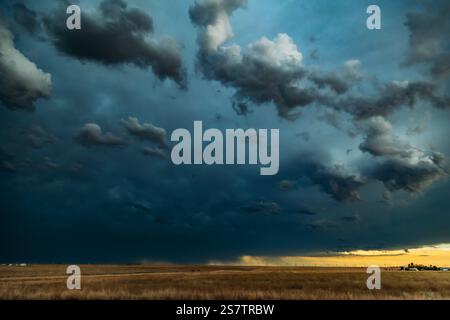 Dark Ominous Clouds with rain in the distance over prairie land Stock Photo