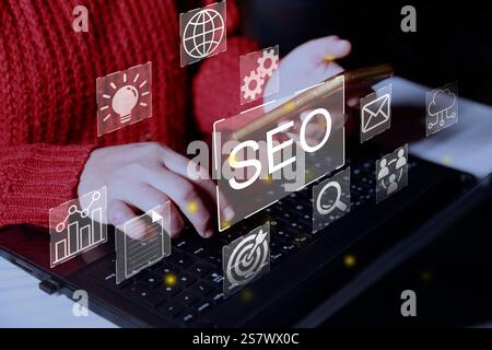 SEO Search Engine, Businesswoman use laptop to analyze SEO search engine optimization for promoting ranking traffic on website and optimizing your web Stock Photo