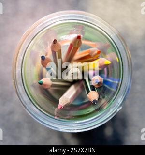 Colored pencils in a glass Stock Photo