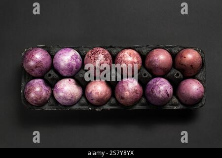 Easter painted eggs in egg tray ready for Easter celebration. Easter layout. Stock Photo