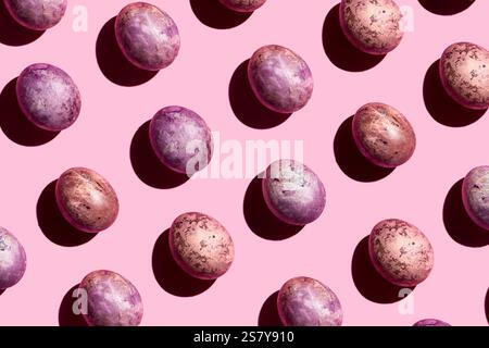 Easter pattern. Painted eggs on pink background. Hard light, hard shadows. Design pattern Stock Photo
