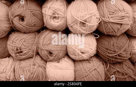 Colorful of Yarn Balls Wool in a Fabric Shop. Background from colored acrylic yarn. Skeins of thread close-up. Materials for needlework, for knitting Stock Photo