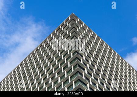 Modern building facade with repeating geometric pattern Stock Photo