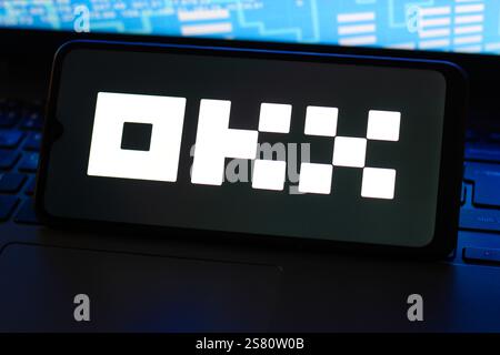 In this photo illustration, the OKX logo is seen displayed on a smartphone screen. Stock Photo