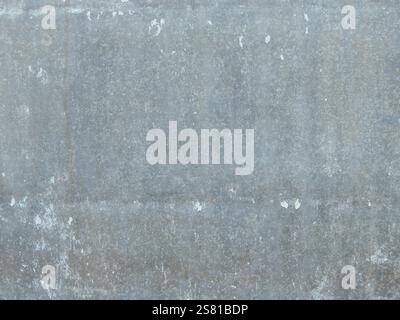 old metal sheet with paint residue as full frame texture, scratched iron weathered surface, light gray hard blank Stock Photo