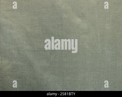 canvas fabric close up as rough grey green textile background, awning fabric macro view full frame as clothing texture, graphic fabric resource Stock Photo