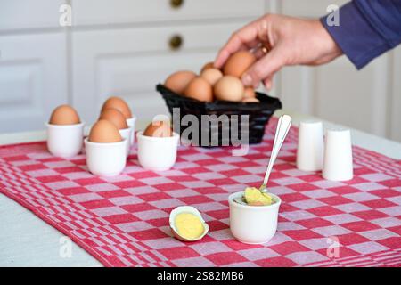Soft-boiled egg on a set breakfast table Stock Photo