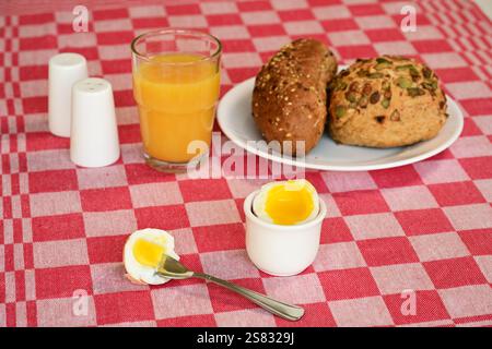 soft-boiled egg on a set breakfast table Stock Photo