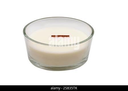 White wax candle. The wax is in a glass holder. It has no label. View from above. Stock Photo