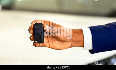 Auto Sale Concept. Closeup Of Car Keys In African American Man Hand Stock Photo