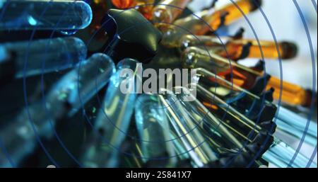 Image of circles moving over test tubes Stock Photo