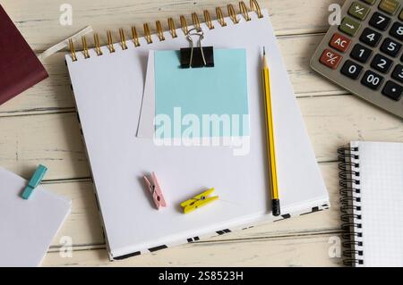 A blank note on my notepad, next to my glasses and documents. Concept of business and finance. Calculator. Stock Photo