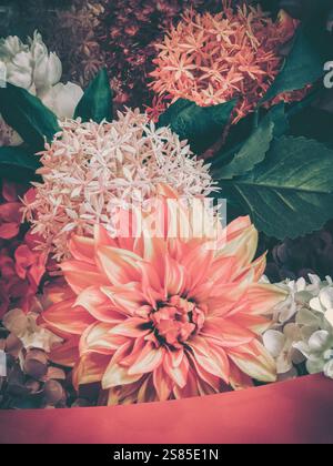 A vibrant bouquet of flowers, perfect for Chinese New Year celebrations.  The image showcases a variety of blooms in warm, rich tones. Stock Photo