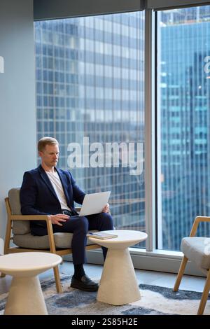 Busy professional business man manager using laptop working in office. Stock Photo