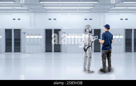 Programmer or engineer work together with assistant robot in server room Stock Photo