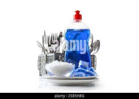 detail of dishwasher products on stack of plates and basket with cutlery behind isolated white. Font view. Stock Photo
