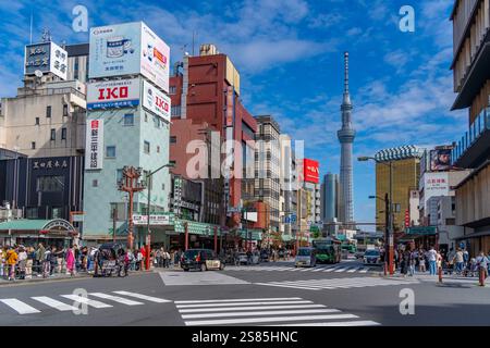 View of colourful shops and buildings with Tokyo Skytree visible in background, Asakusa, Taito City, Tokyo, Honshu, Japan Stock Photo