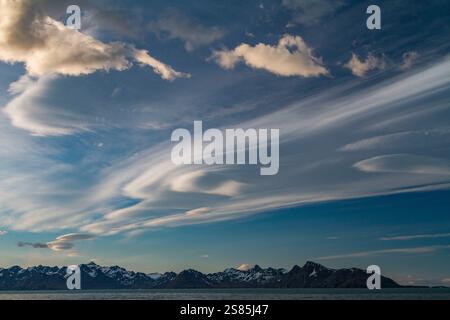 Interesting lenticular cloud formations forming over the island of South Georgia in the Southern Ocean Stock Photo