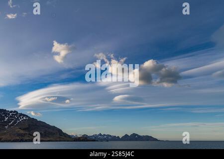 Blue sky with lenticular cloud formations, a rare natural phenomenon ...