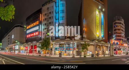 View of street scene and shops in Hiroshima at night, Hiroshima, Honshu, Japan Stock Photo