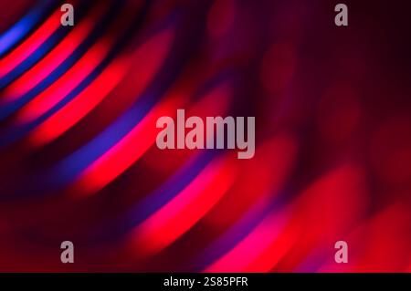Blurred abstract of red and blue reflections on metal rings Stock Photo