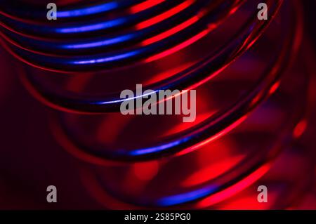 Abstract of colorful light reflecting on metallic rings Stock Photo