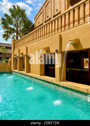 Modern Tropical Pool with Water Fountains and Palm Trees A modern ...
