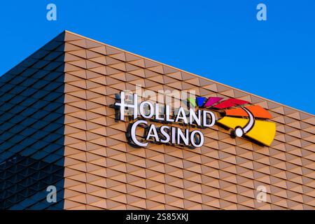 Holland Casino illuminated logo on illuminated building. Stock Photo