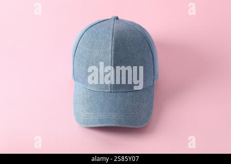 Stylish denim baseball cap on pink background. Mockup for design Stock Photo