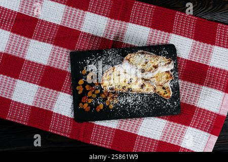 Christmas Stollen on a Black Slate Plate Stock Photo