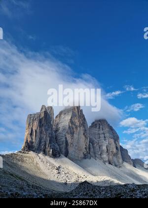 Incredible view of the Three Peaks of Lavaredo, Tre Cime di Lavaredo, Dolomites, Italy. Mountain peaks in the clouds Stock Photo