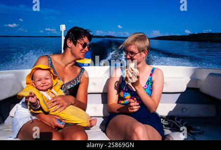 Three generations in a boat Stock Photo
