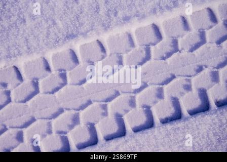 Tire tracks in snow Stock Photo