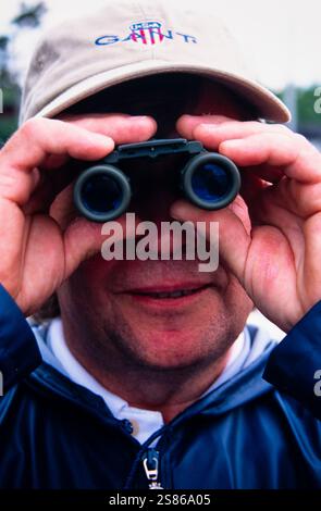 Man with binoculars Stock Photo