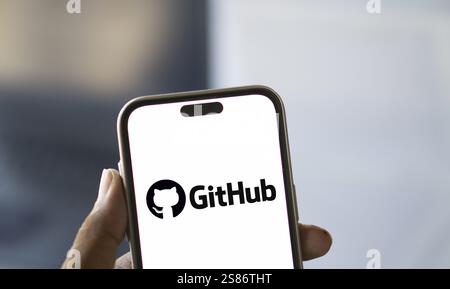 github logo is displayed on smartphone. GitHub is a proprietary developer platform Stock Photo