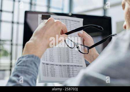 A male manager is reviewing marketing reports for the new campaign Stock Photo