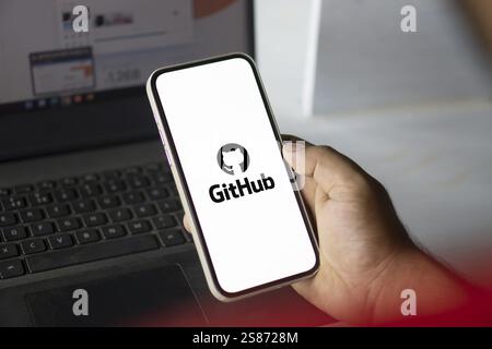github logo is displayed on smartphone. GitHub is a proprietary developer platform Stock Photo