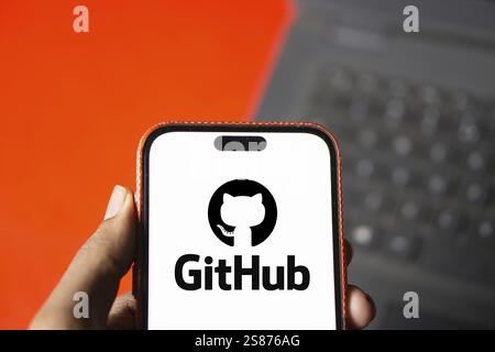 github logo is displayed on smartphone. GitHub is a proprietary developer platform Stock Photo