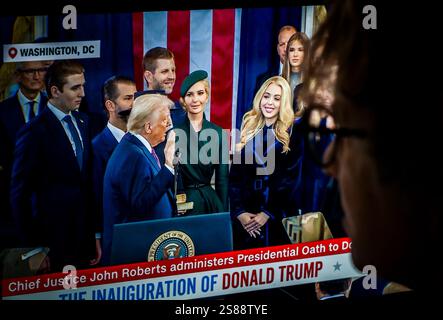 U.S. President Donald Trump watches as the American flag is raised for ...