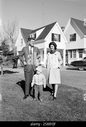 Senator John F. Kennedy with his wife Jacqueline Kennedy and daughter Caroline, standing outside their house, Irving Street, Hyannis Port, Massachusetts on election day, 1960 Stock Photo