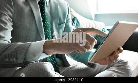 Businessman entrepreneur hand finger typing texting on laptop keyboard in office. E-commerce or business working at home office. Stock Photo
