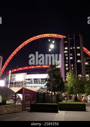 Wembley Stadium lit up at night. Stock Photo