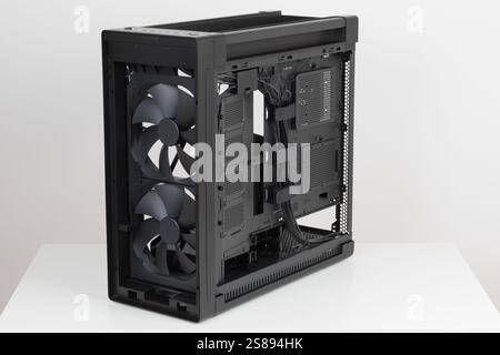 Side view of  PC case, chassis, without upper , front, right  metal panel  and glass left  panel. Two   extra-thick 200 x 38 mm front fans . Chassis s Stock Photo