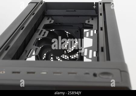 Big tower, PC case, chassis, close up rear fan 140 x 28 mm and  top of the computer case.  Without upper and tempered-glass left panel. Stock Photo
