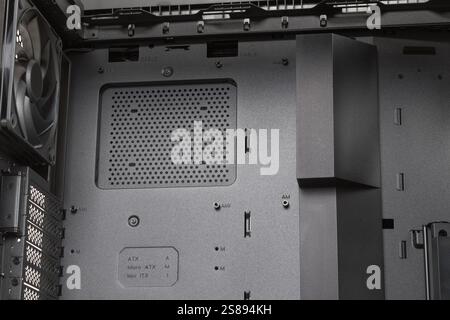 Empty  big tower, PC case, chassis, without upper panel , place for screwing the ATX or micro ATX or mini ITX  motherboard . Rear fan 140 x 28 mm. Stock Photo