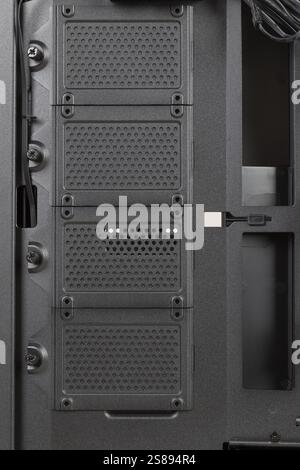 Side view of empty  big tower, PC case, chassis, without  right  metal panel . Place for four SATA SSDs.  Storage capacity for data storage needs. Stock Photo